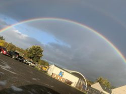 Rainboe over school building