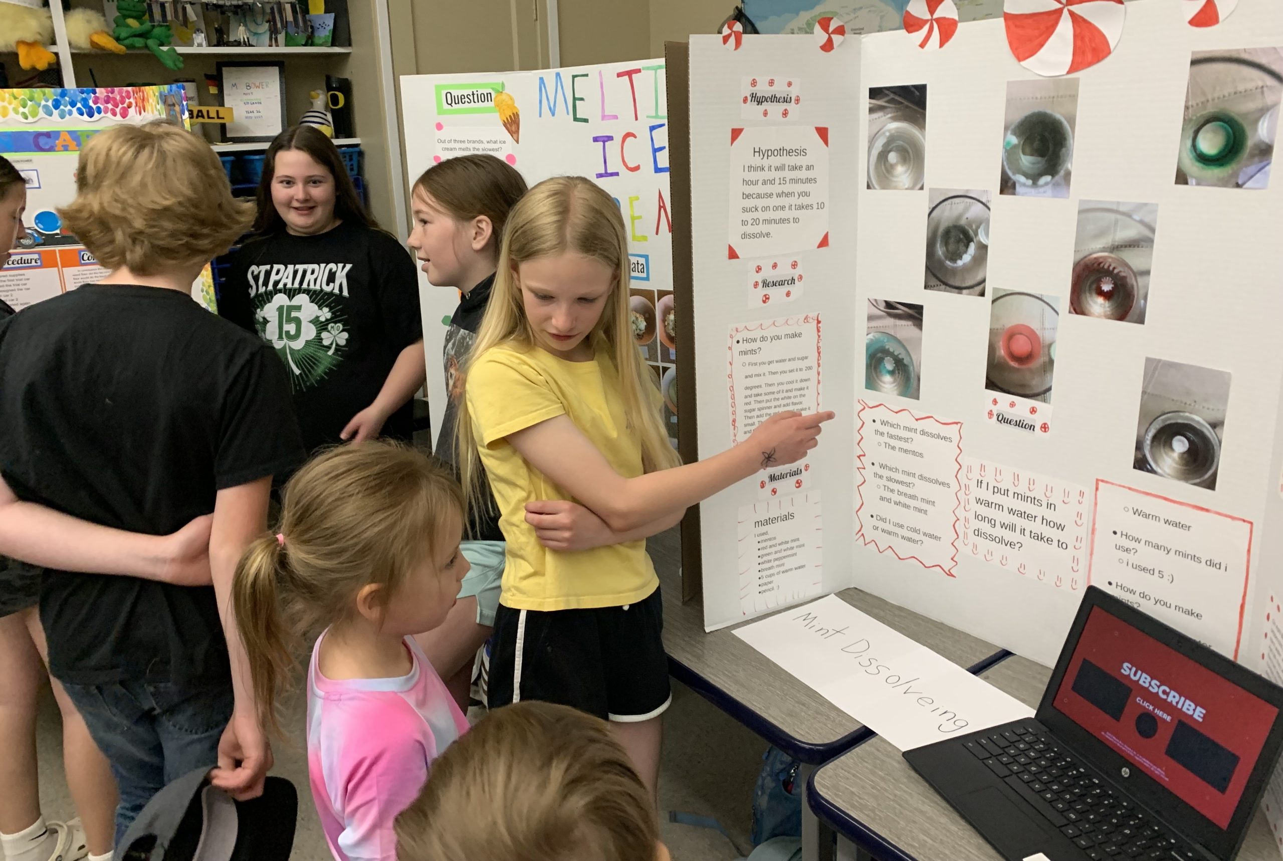 student presenting her science poster